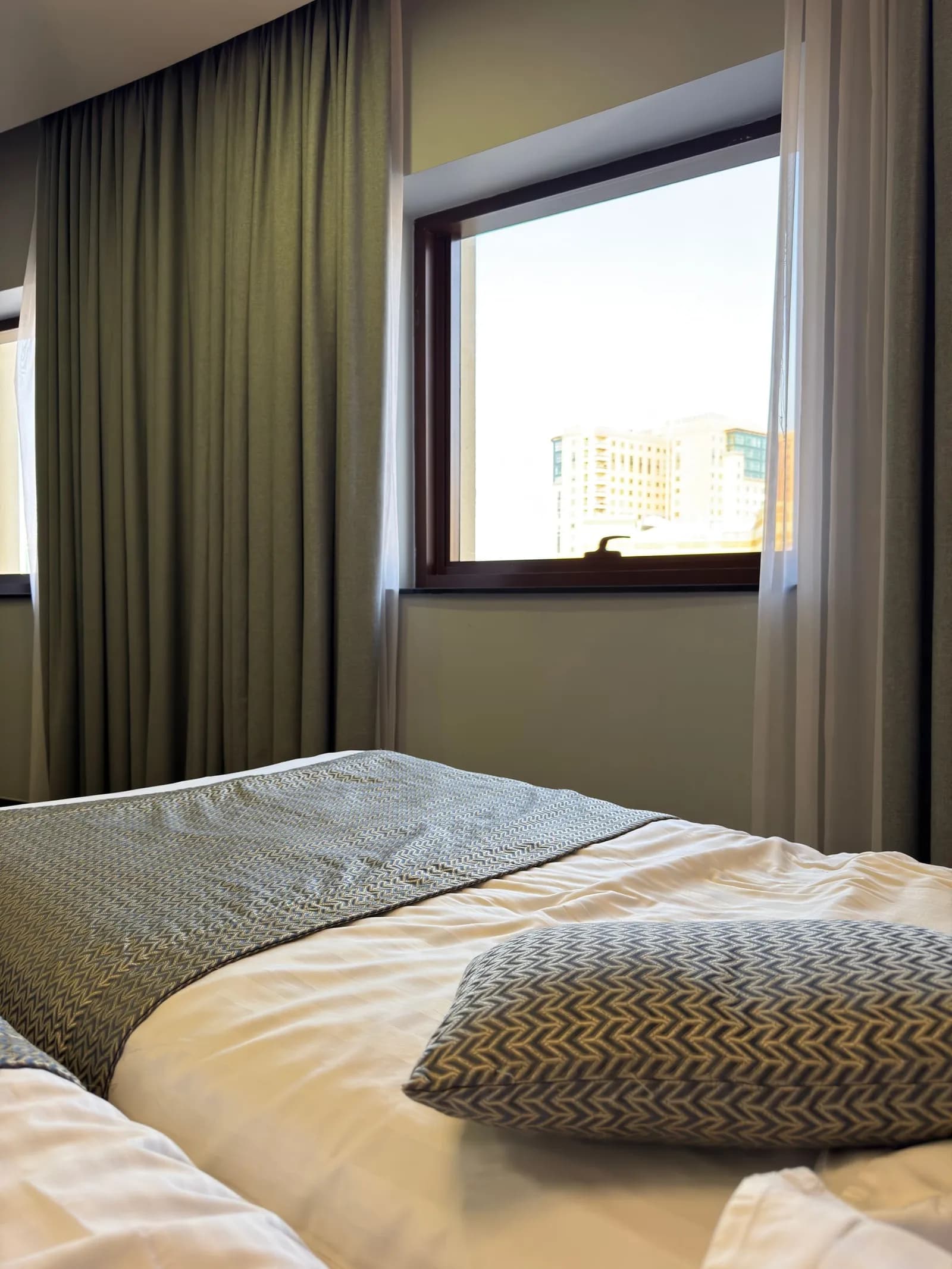 Illustrative stock photograph: bed/window room detail